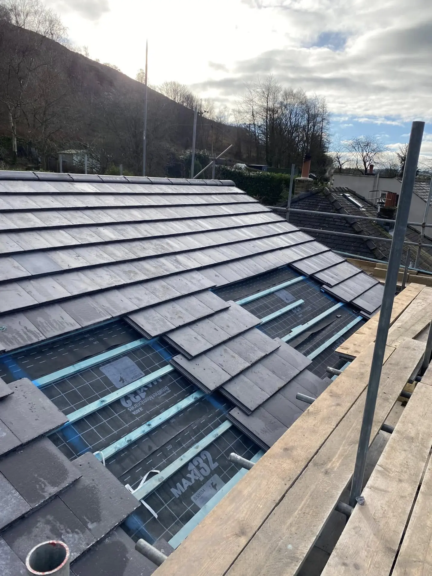 Slate re-roof in progress with breathable membrane